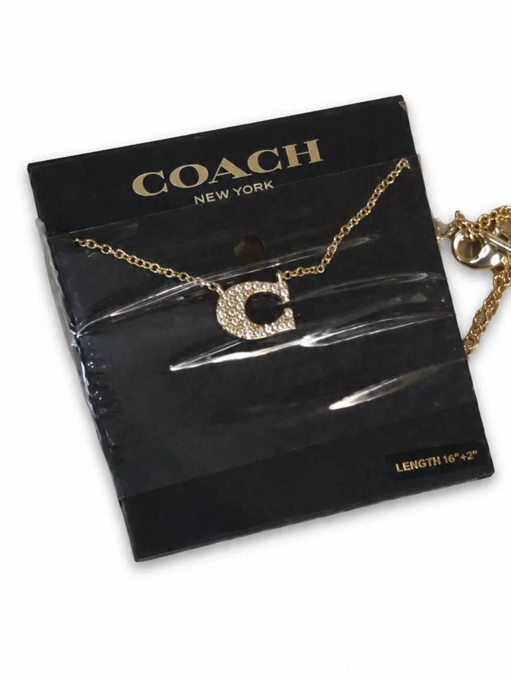 Coach gold tone